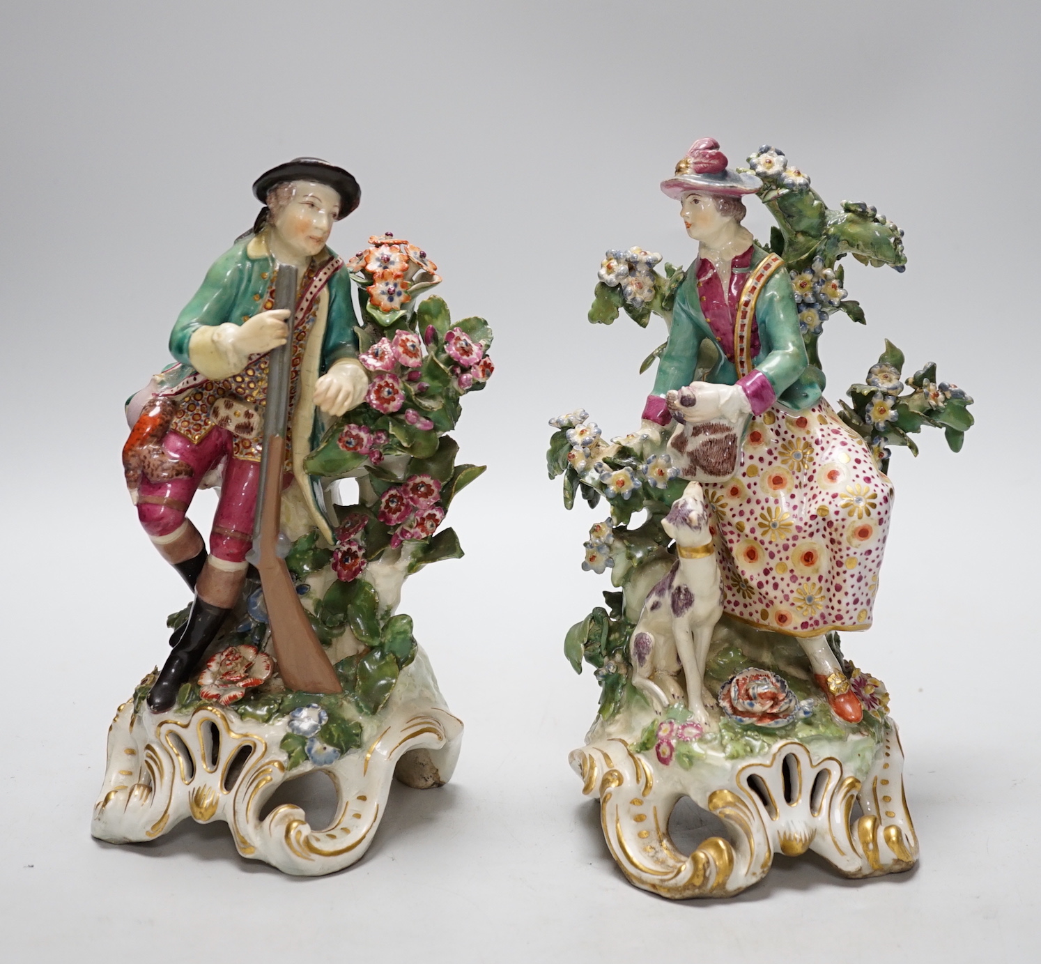 A pair of Chelsea gold anchor period figures wearing 18th century dress, c.1760-65, 22cm